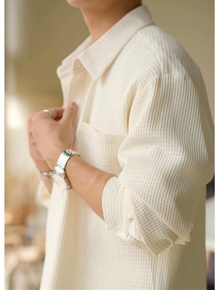 White waffle polo-collar jacket close-up with button placket and chest pocket