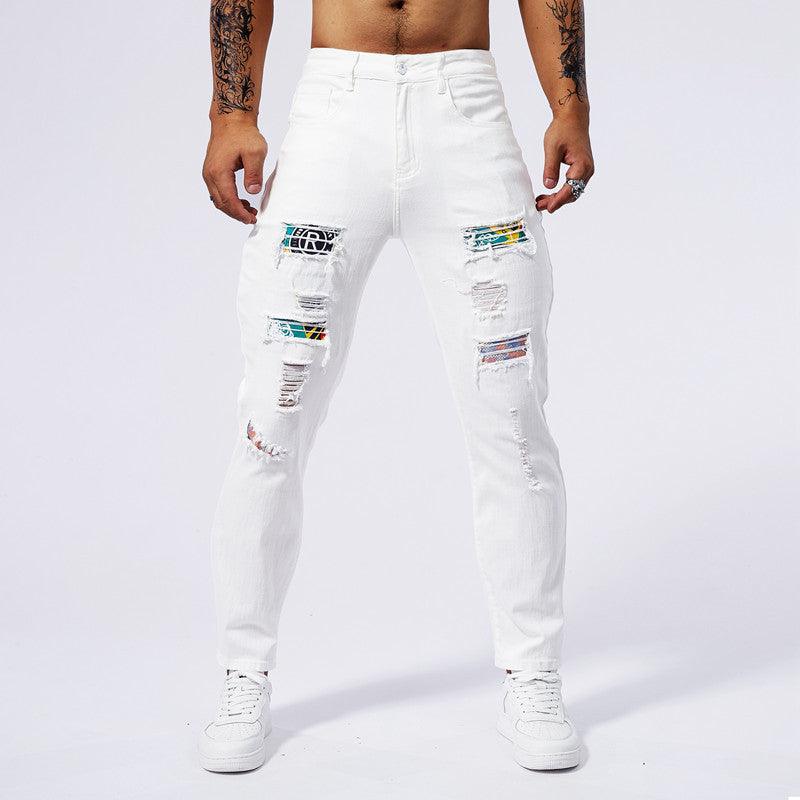 White washed hole-patch jeans on model, front view with colorful patch rips