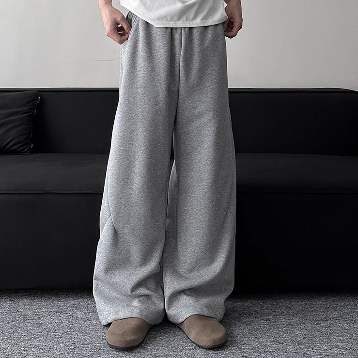Light gray wide-leg sweatpants with elastic waist and drawstring, relaxed fit