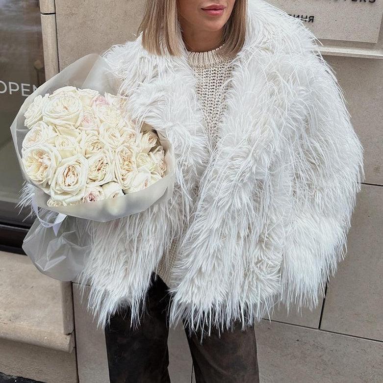 White shaggy long-sleeve jacket with loose fit and fringed texture, V-neck opening