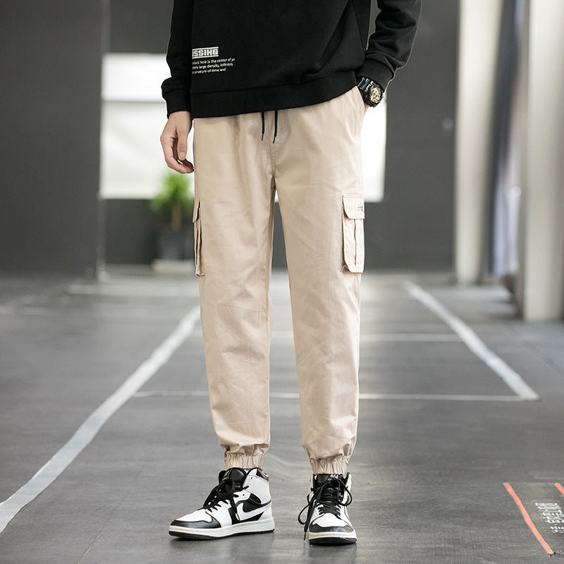 Men's khaki cargo jogger pants with side utility pockets and cuffed hems