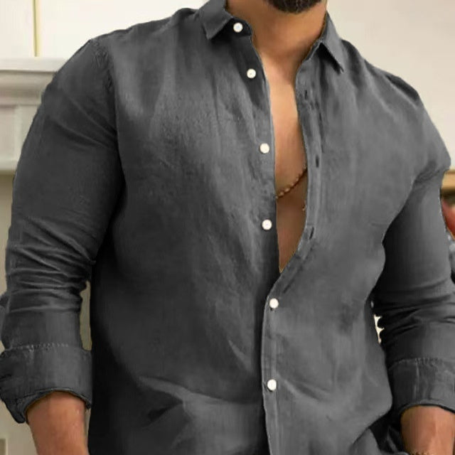 Dark gray long-sleeve button-up shirt with white buttons and open collar