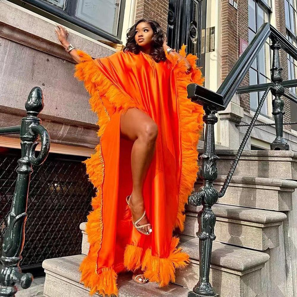 Orange loose maxi dress with feather-trimmed sleeves and fringe hem