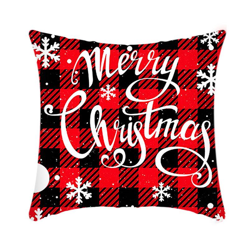 Christmas cushion cover with red and black plaid and white “Merry Christmas” script