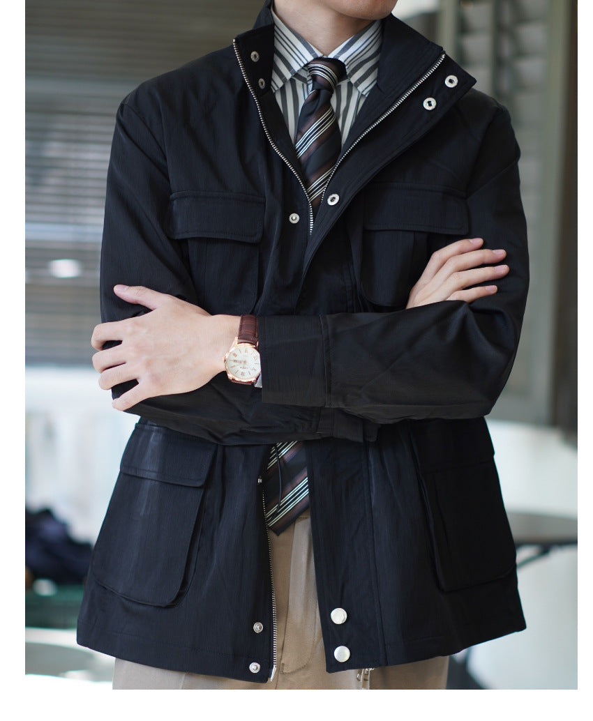 Men's navy windbreaker coat with snap buttons and multiple flap pockets, front view
