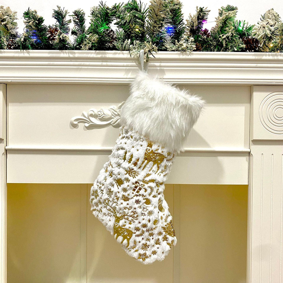 Hanging plush Christmas stocking in white with gold snowflake print and fluffy cuff