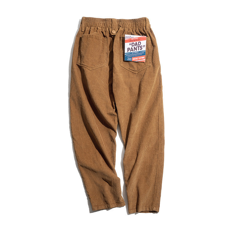 Men's wide-leg loose long pants in warm brown with elastic waistband and front pockets