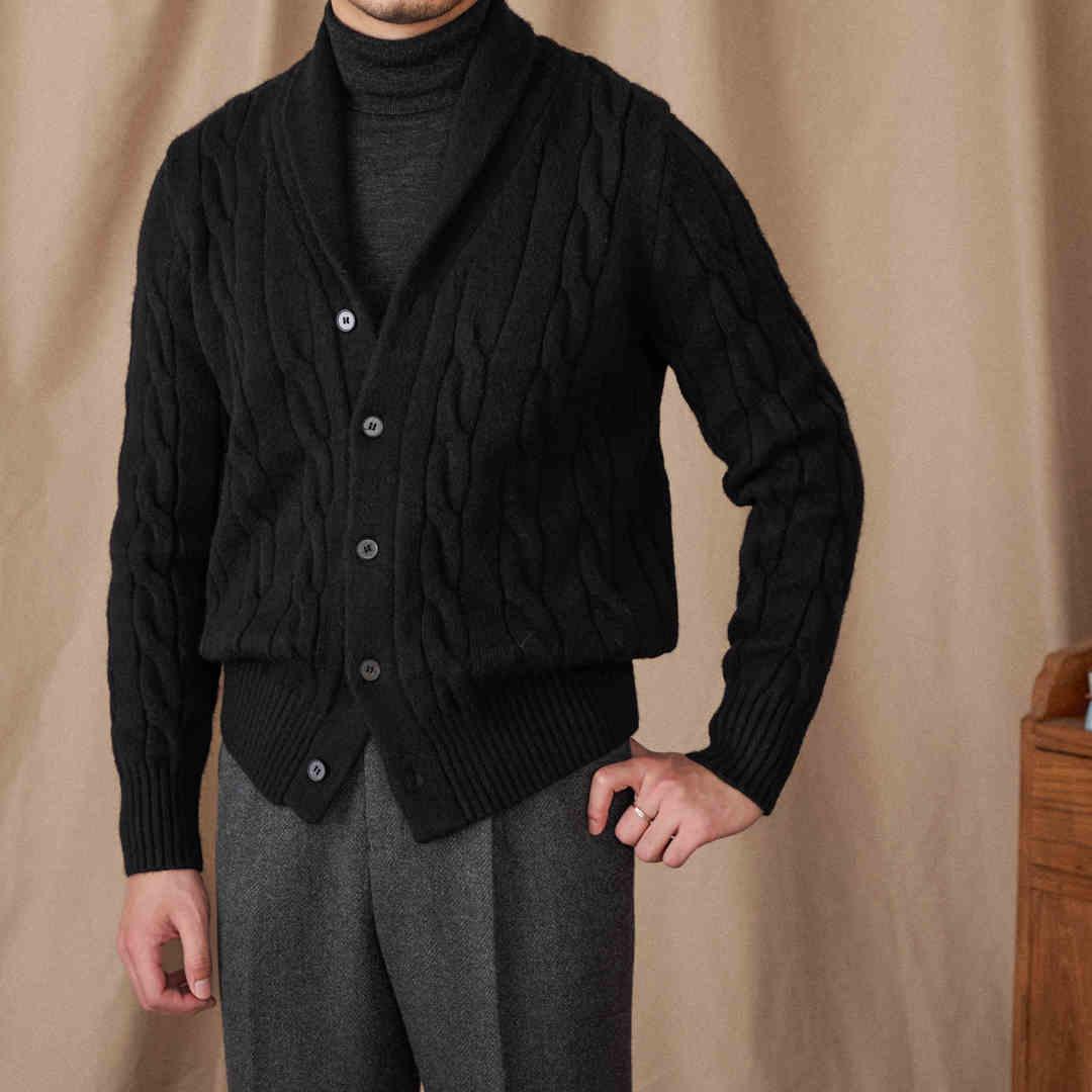 Black twisted cable knit cardigan sweater with button front and ribbed cuffs