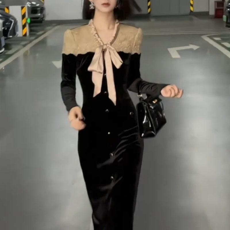 Black long-sleeve bowknot single-breasted slim-fit dress with beige collar, hands at sides
