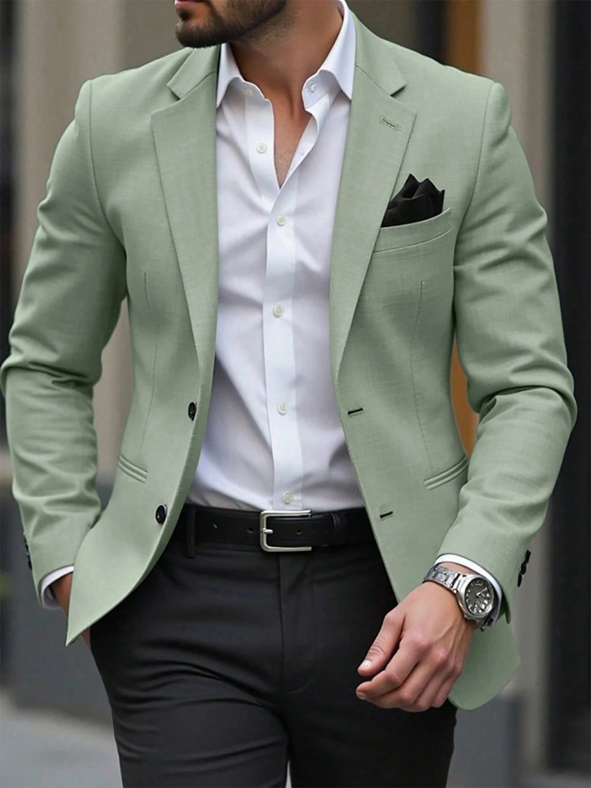 Light green men’s blazer jacket with notch lapels, chest pocket square, and front buttons