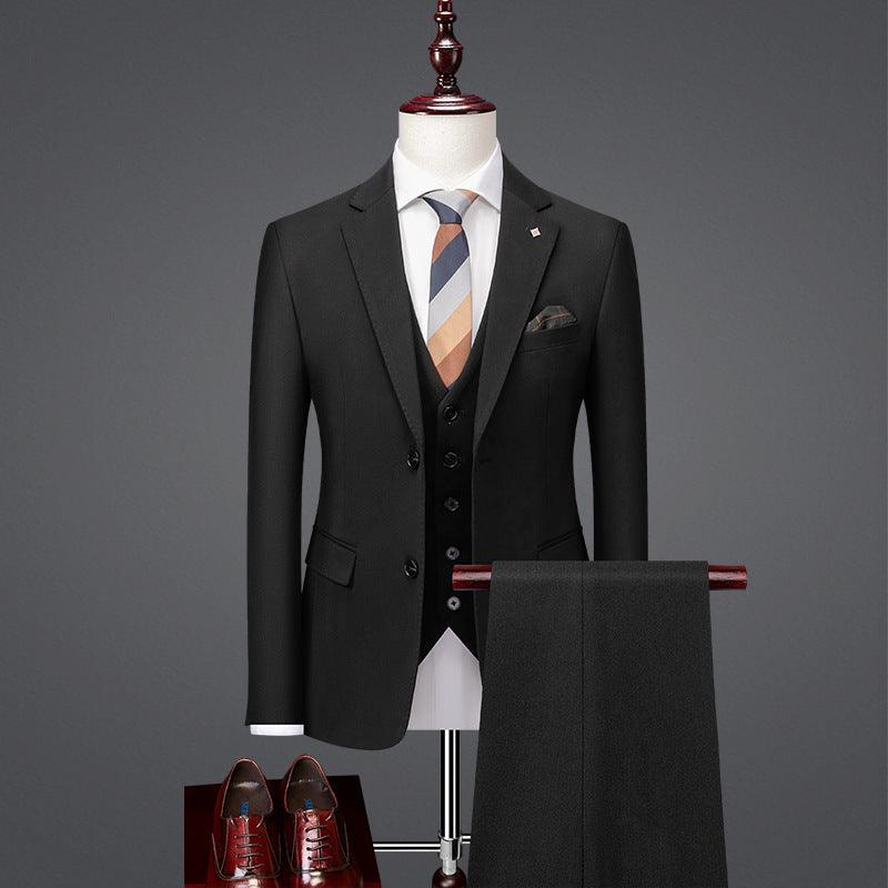 Men's black business suit with vest, striped tie, pocket square, and matching trousers