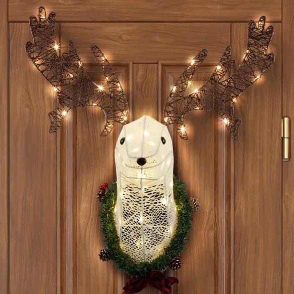 Pre-lit hanging Rudolph wreath with white dog, green foliage, brown glowing antlers, bow