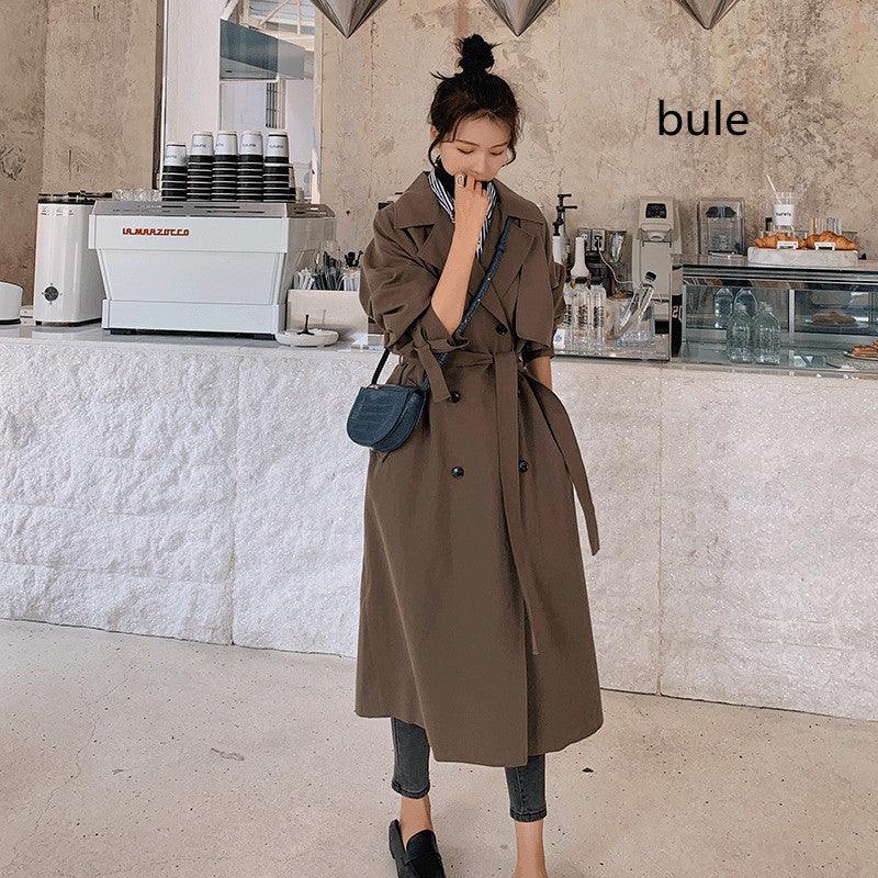 Coffee double-breasted trench coat with suit collar, belt cinch, and front button rows