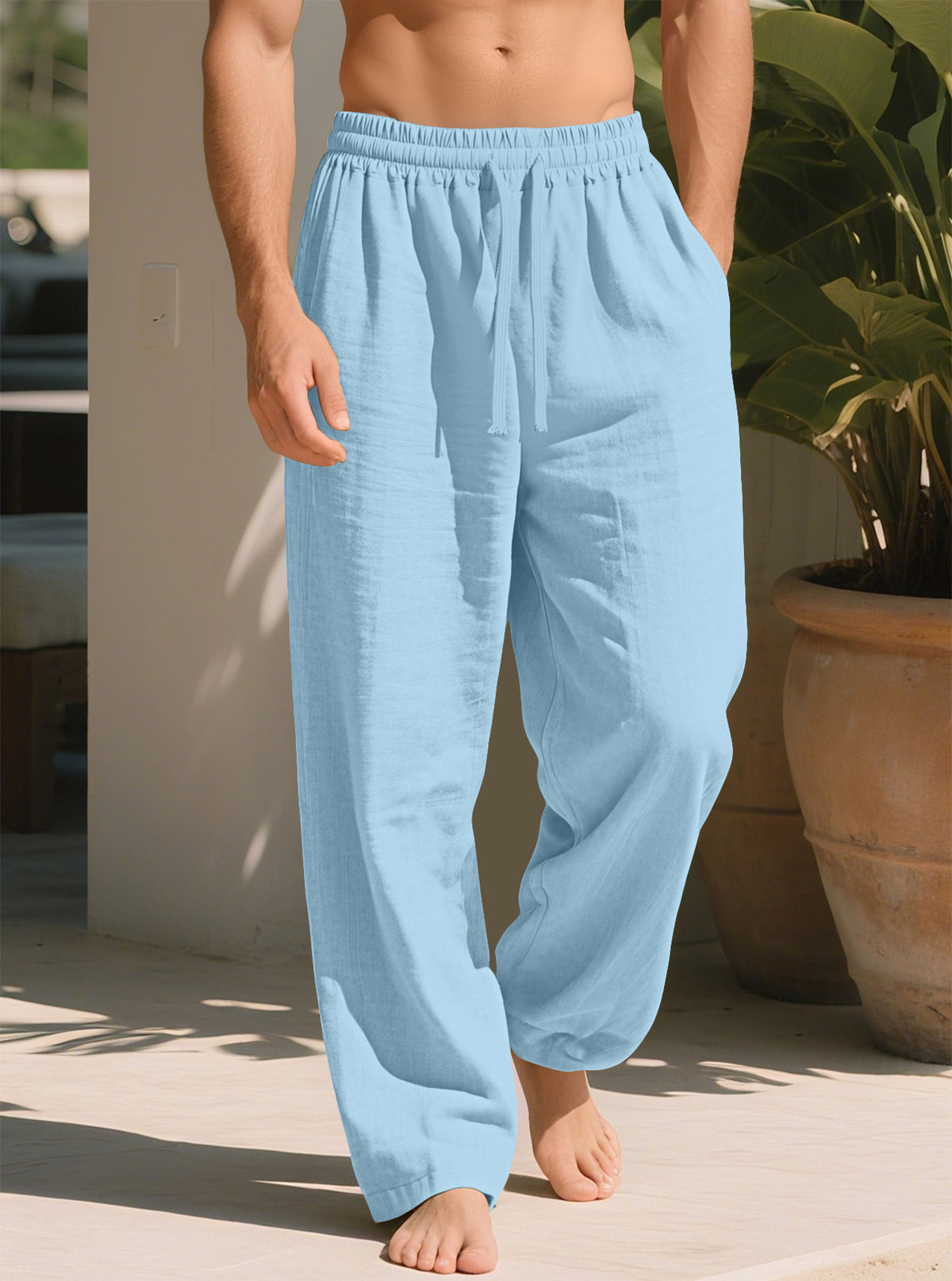 Light blue loose straight trousers with elastic waistband and ankle-length relaxed fit