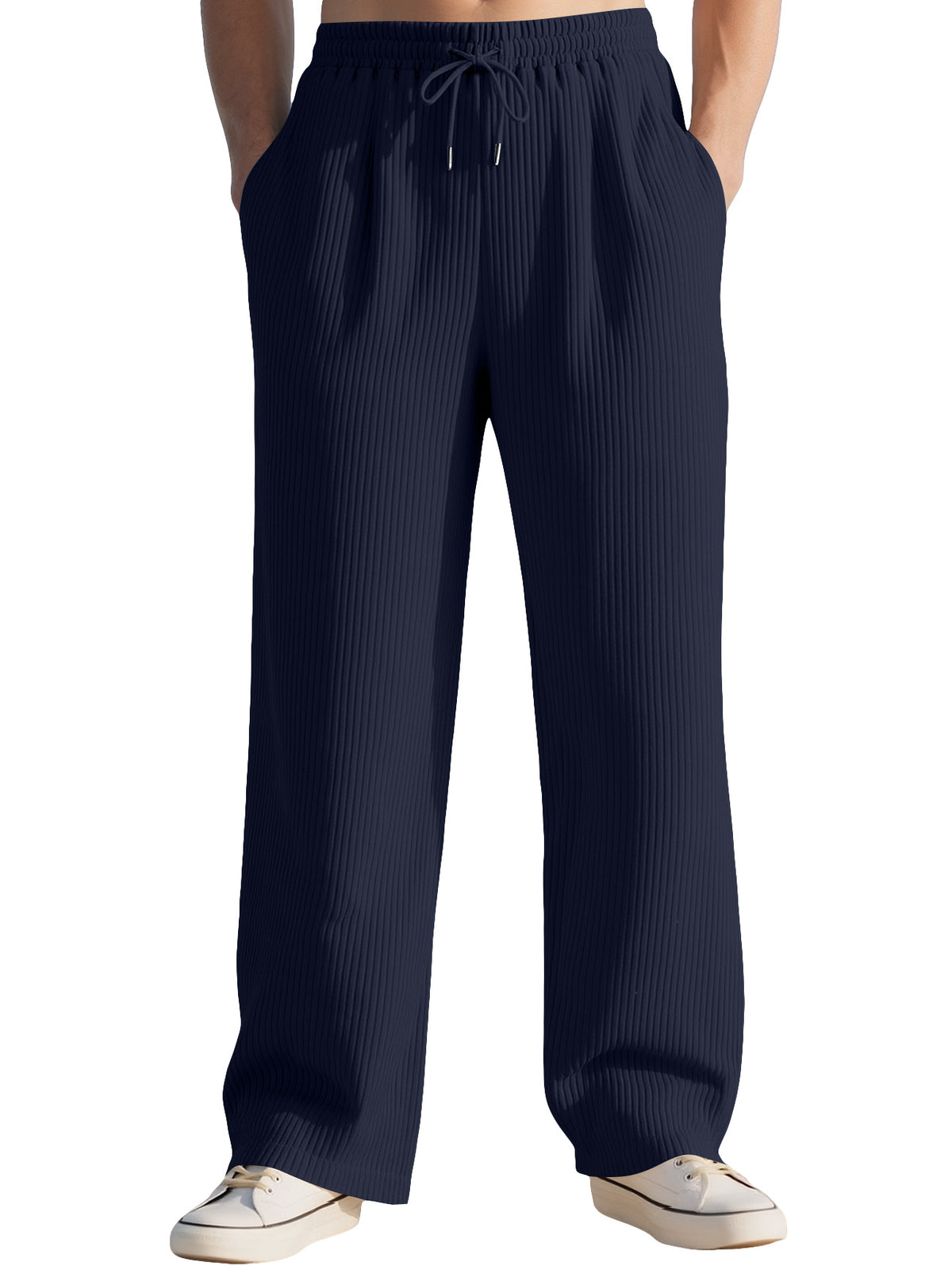 Navy wide-leg sports sweatpants with ribbed texture, elastic waist, and drawstring.