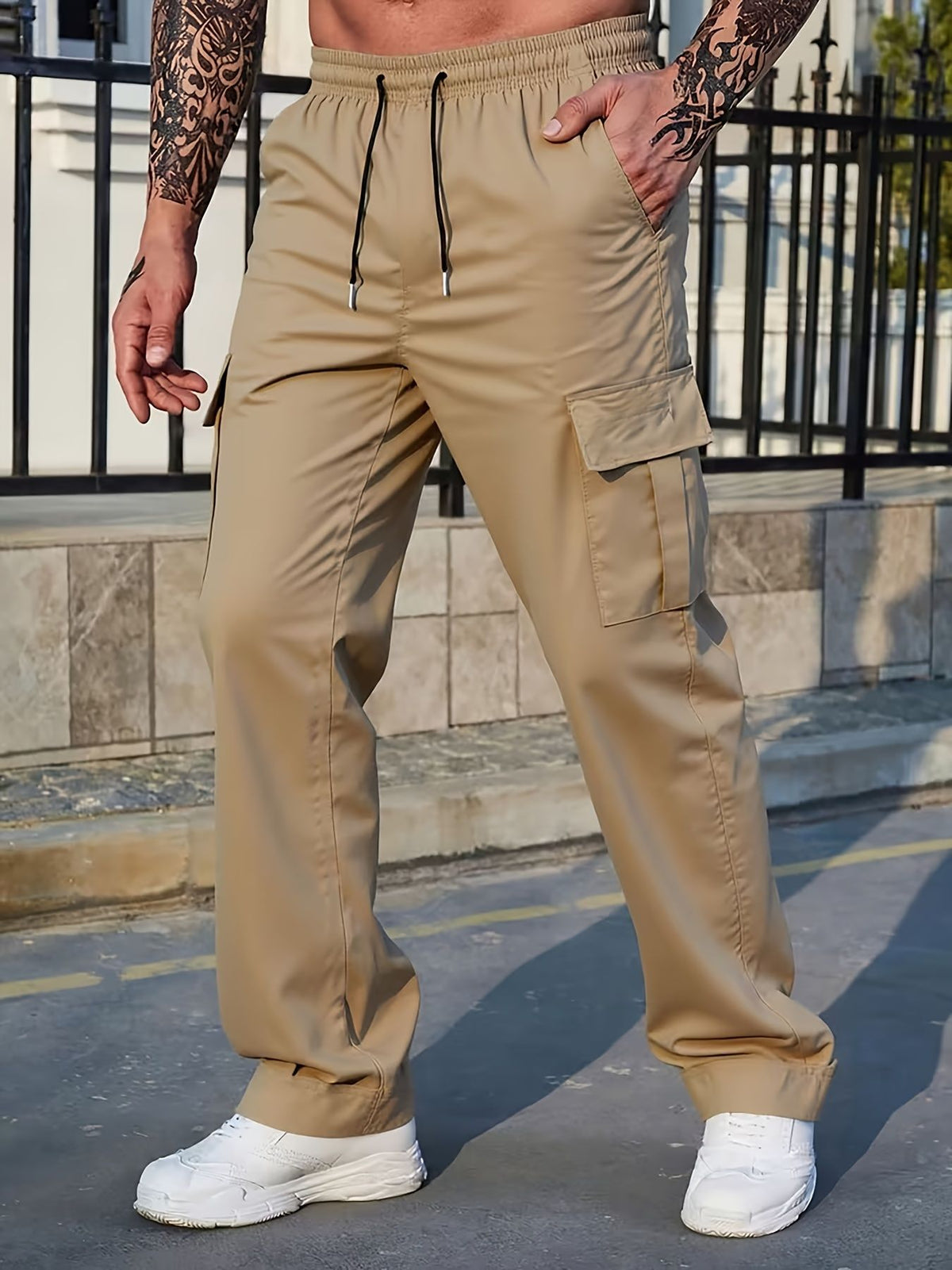Men's tan cargo-style casual pants with drawstring waist and side cargo pockets