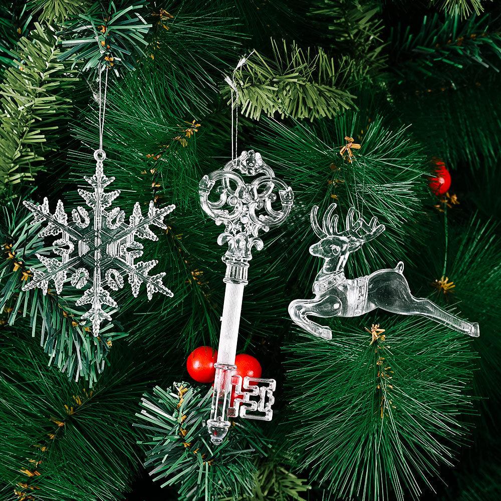 Transparent deer and snowflake Christmas ornaments on hanging strings