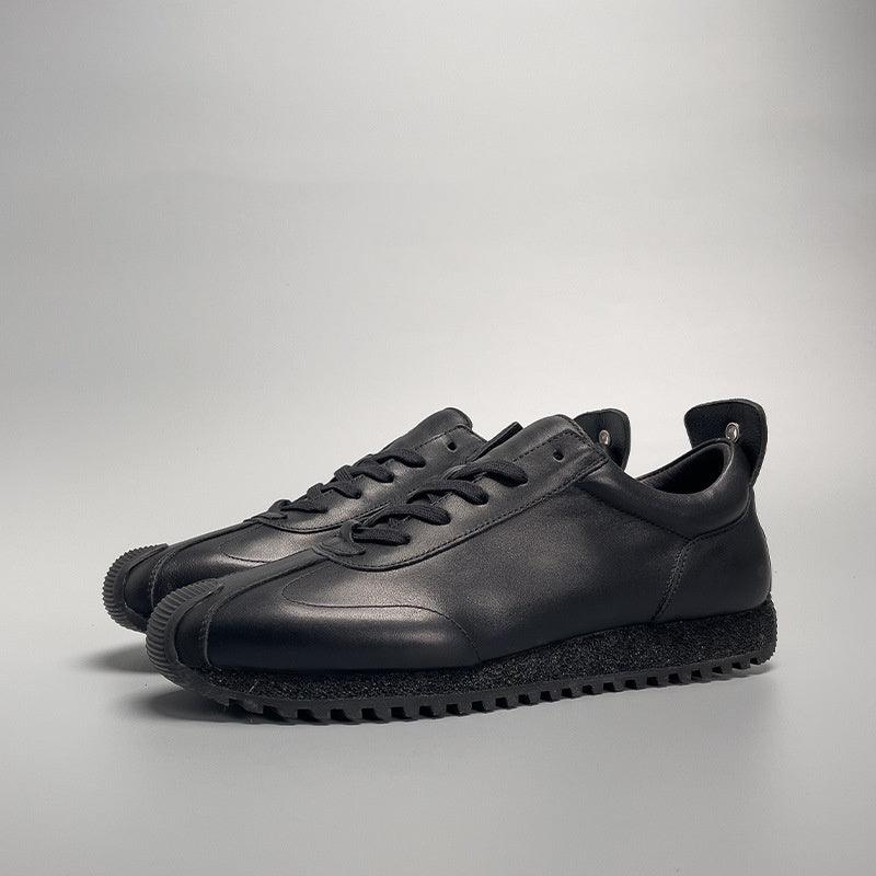 Black leather lace-up casual sneaker with rubber tread sole