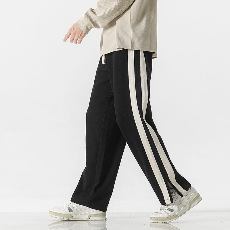 Men's black thin striped track trousers with long vertical stripe side panels