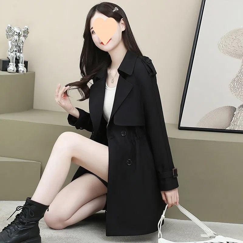 Women's mid-length trench coat in black, loose fit, double-breasted buttons, flap pockets