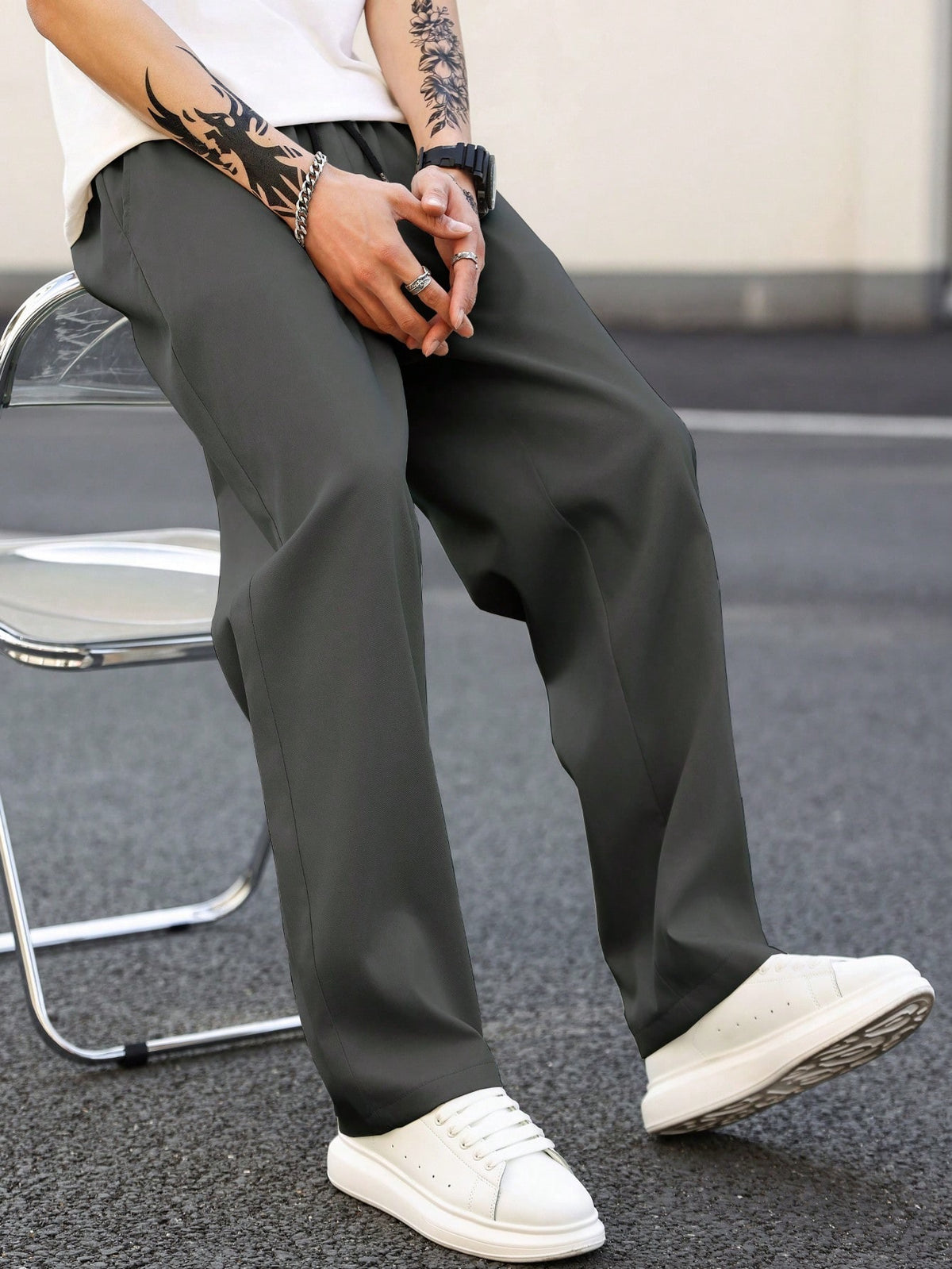Black straight-leg casual pants, roomy drape