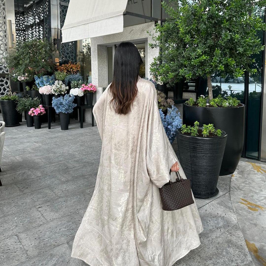 Beige metallic abaya robe with loose fit, V neckline, and wide draped sleeves