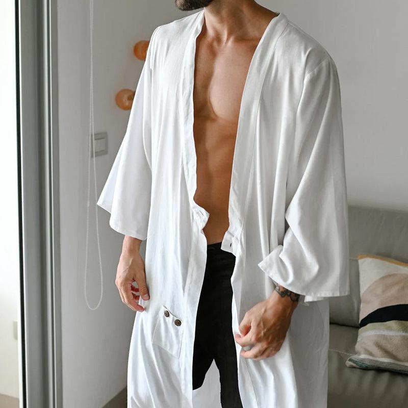 White button-front V-neck shirt with 3/4 sleeves and curved open front, long length