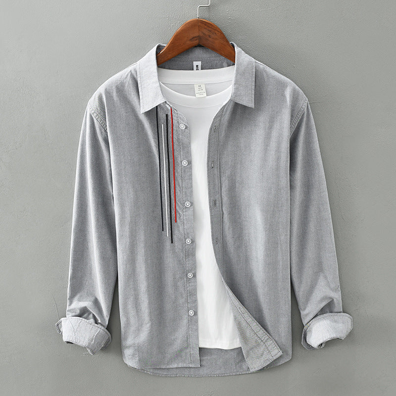 Gray cotton shirt jacket with button front and long sleeves