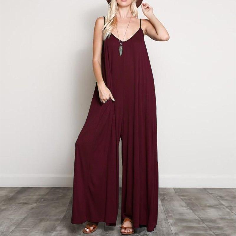 Wine red V-neck sleeveless long jumpsuit with wide legs and spaghetti straps.