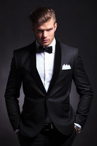 Men's black two-piece suit with bow tie and waistcoat, three-quarter stance