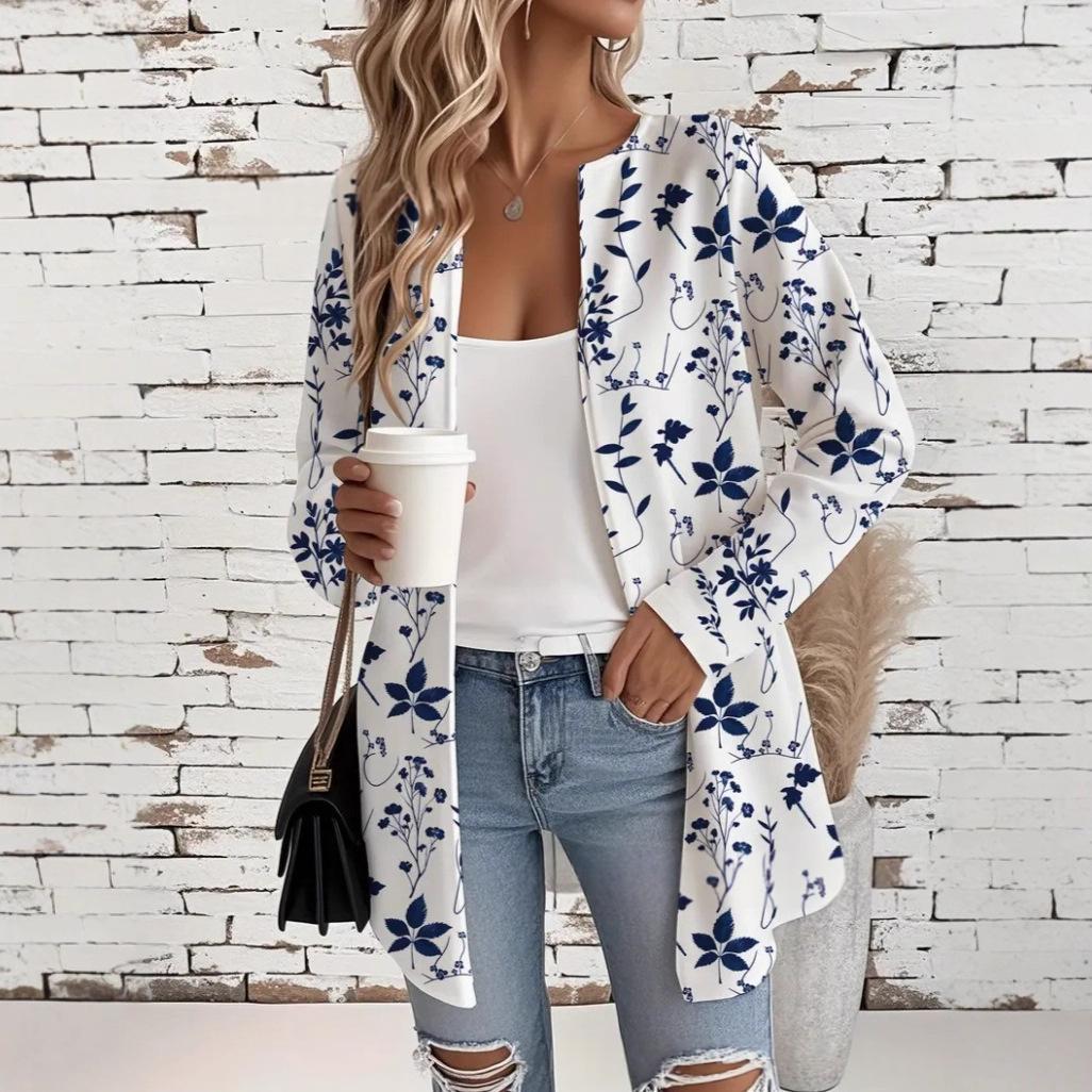 Womens mid-length long-sleeve coat, white with navy blue floral print, open front.