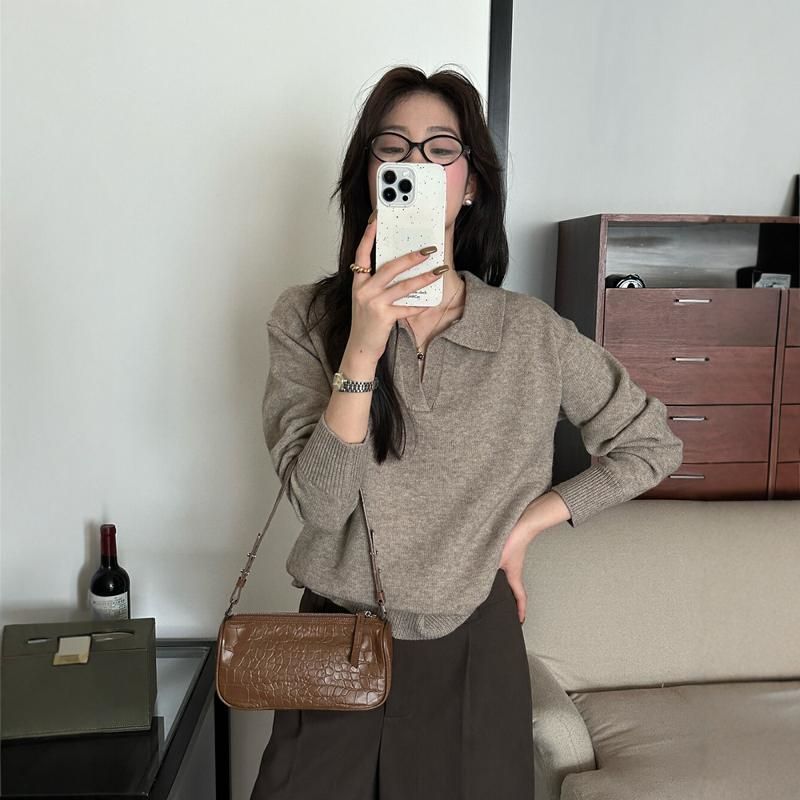 Gray knitted long-sleeve top with polo collar and button placket