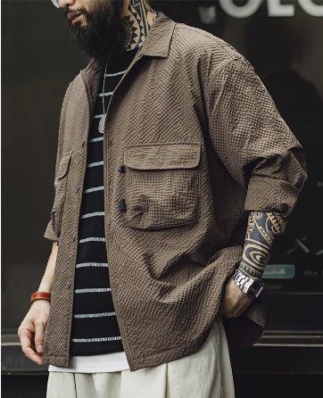 Brown seersucker long-sleeve shirt with point collar, two flap chest pockets, button front