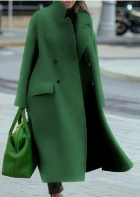 Long green overcoat with lapels, button front, long sleeves, and side pockets.