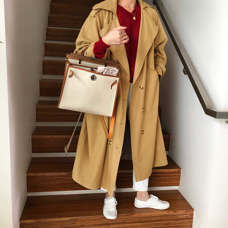 Women's extra-long belted trench coat with flared hem