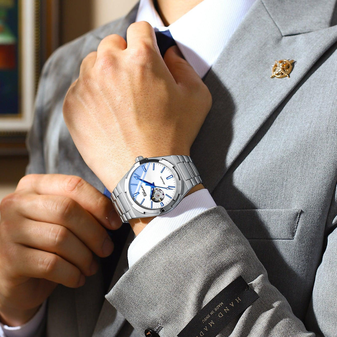 Silver-tone automatic mechanical watch with light blue dial and steel bracelet