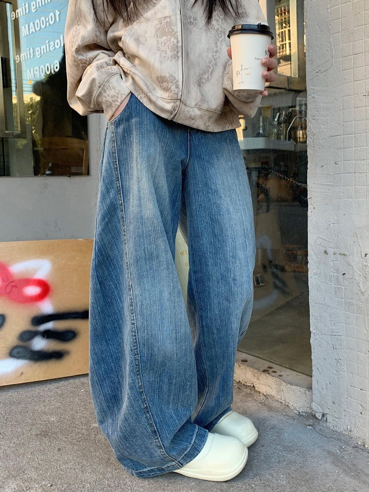 Blue washed distressed wide-leg jeans for women, relaxed fit, front pockets