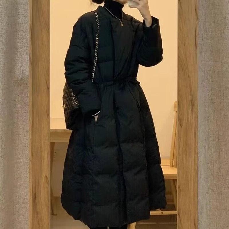Black cotton-padded long coat, zip front, stand collar, quilted panels, cinched waist