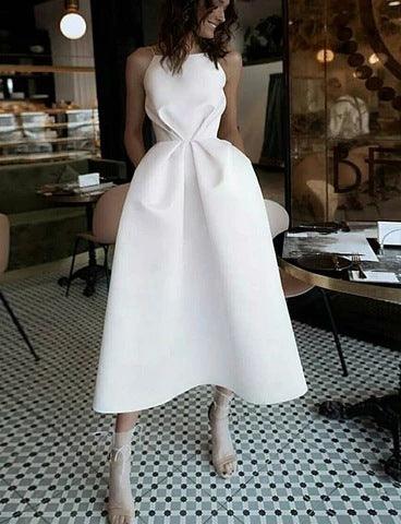 White sleeveless evening dress with scoop neck and tied waist bow, midi length.