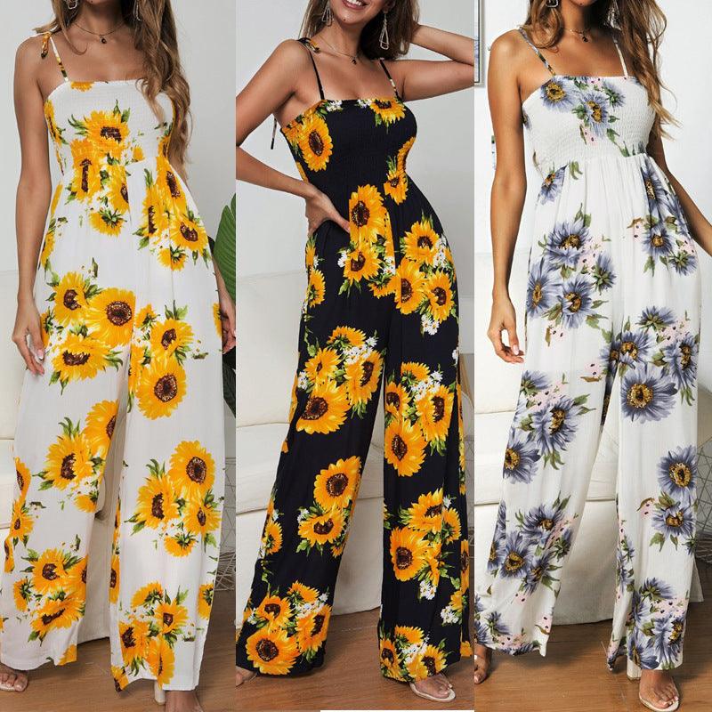 Sling jumpsuit with white background and bold yellow sunflower print, wide-leg silhouette