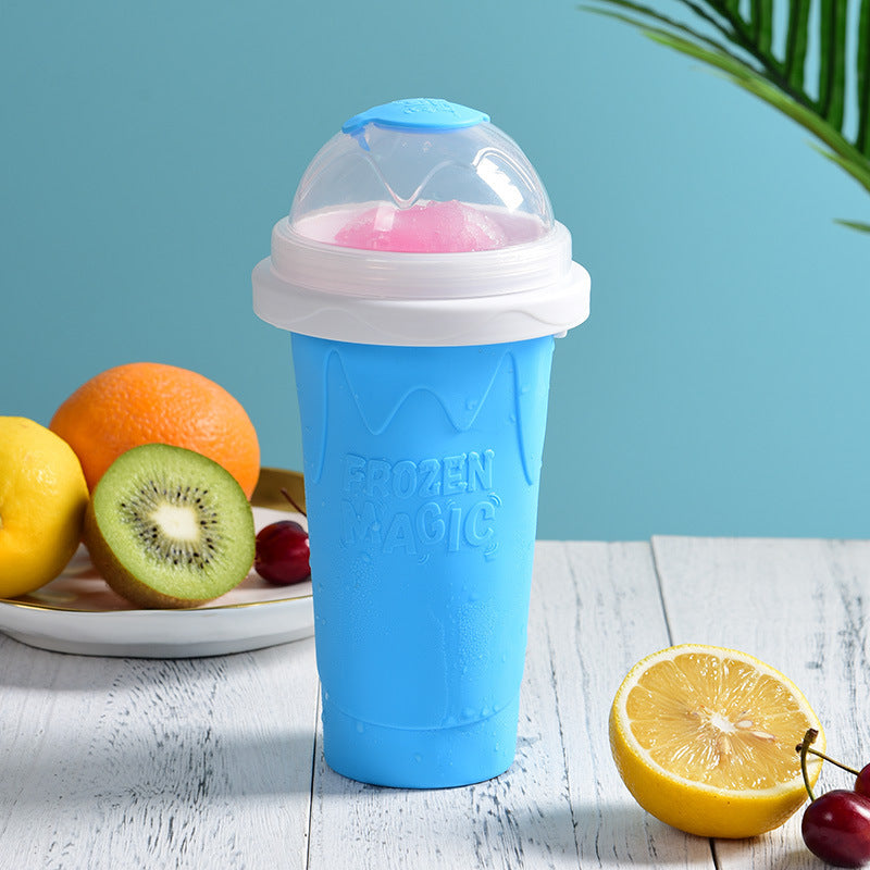 Blue freezer smoothie cup with clear dome lid and pink ice insert