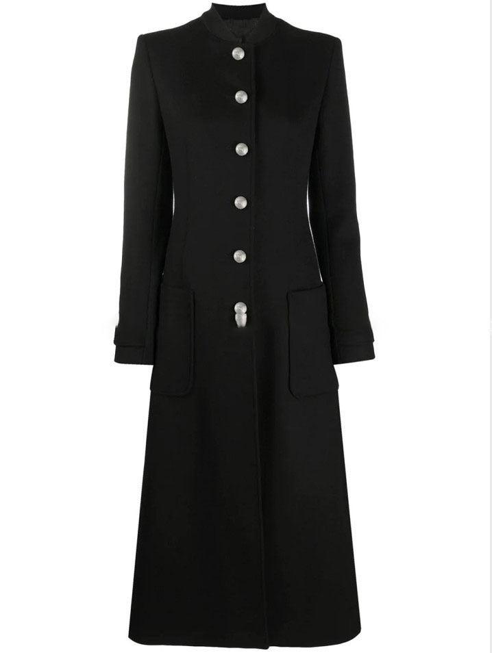 Black long wool coat with stand collar, button placket, and patch pockets.