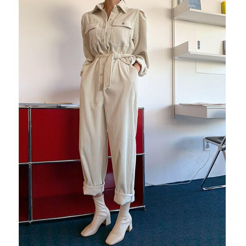 Women’s long-sleeve lapel jumpsuit in light cream, belted waist, button front pockets