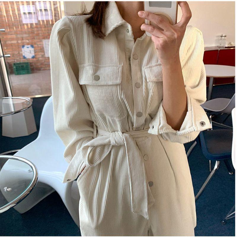 Women’s light cream long-sleeve lapel jumpsuit with button front and gathered waist tie