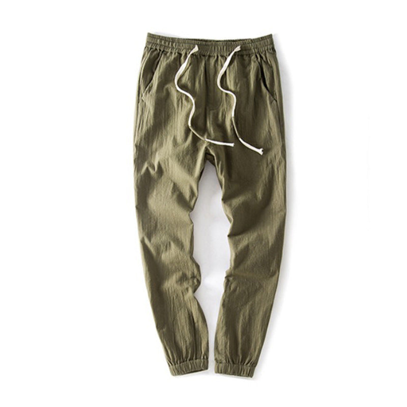 Olive green cropped jogger pants with elastic cuffs and drawstring waist