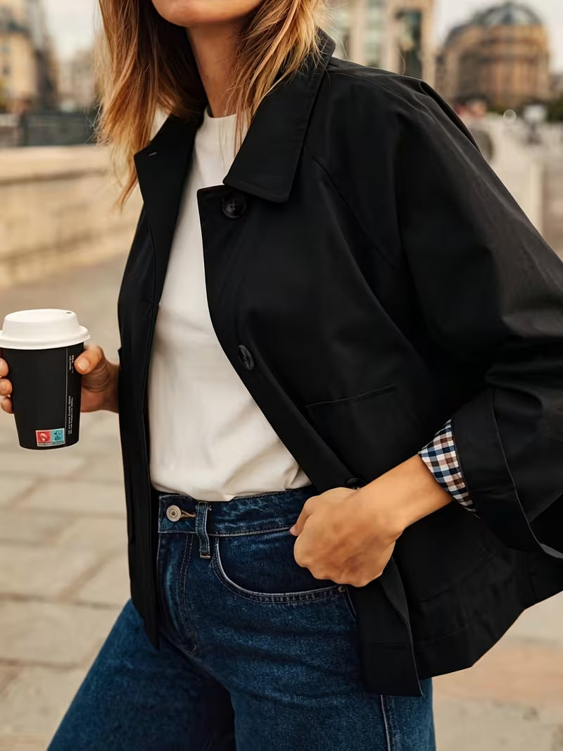 Women’s black casual jacket with button front and flap pockets, long sleeves