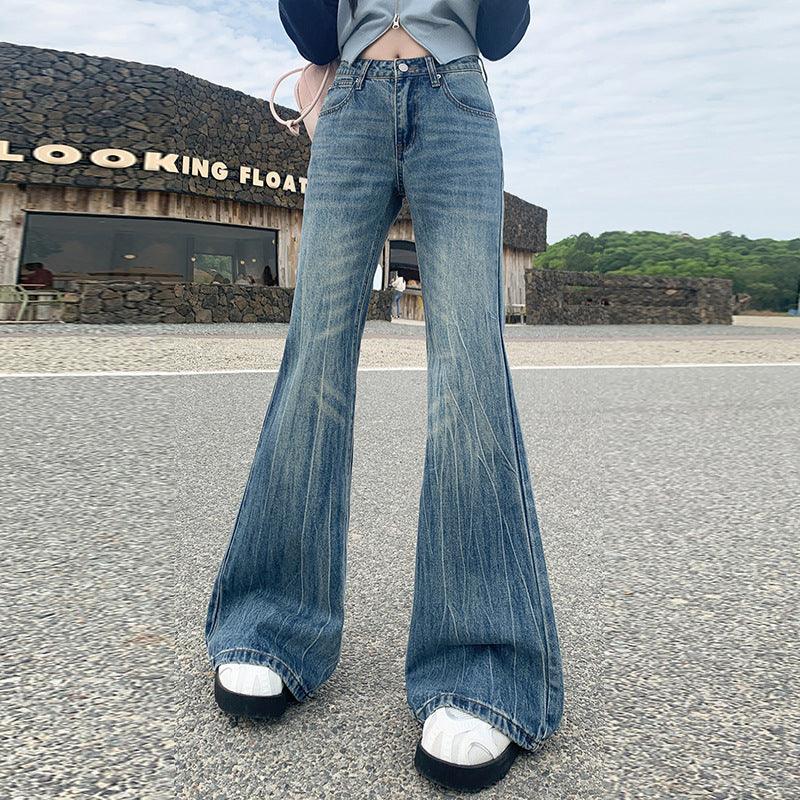 Light blue bell-bottom jeans with flared legs, button-fly front, and faded wash.
