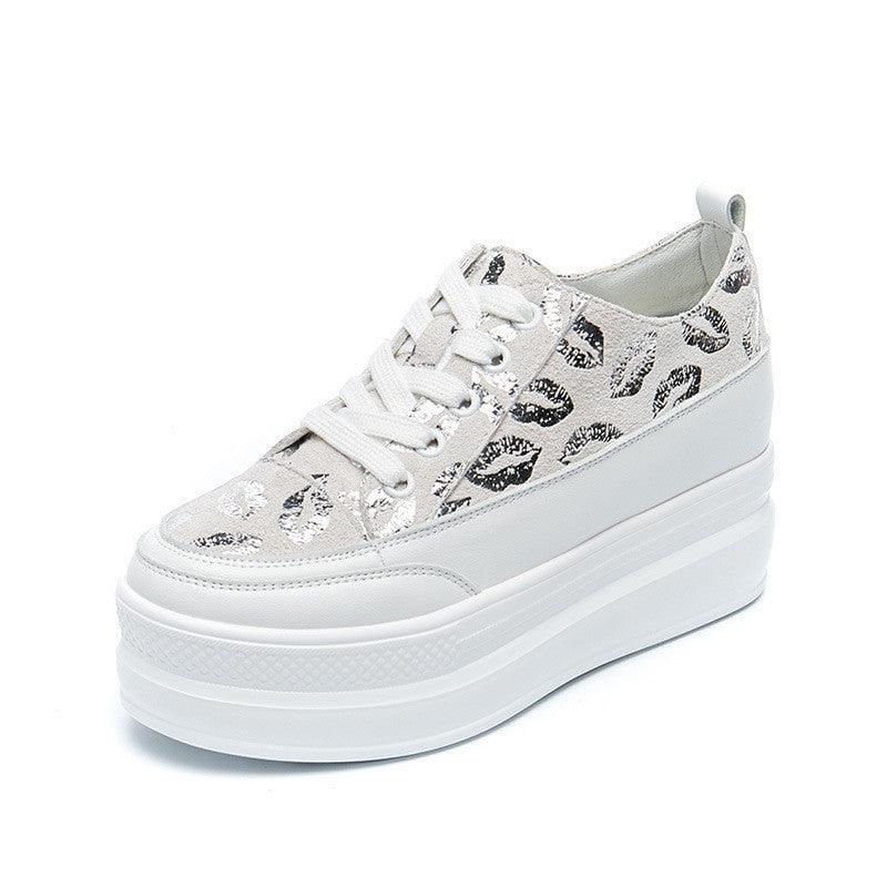 White platform sneakers with leopard print trim and thick stacked sole