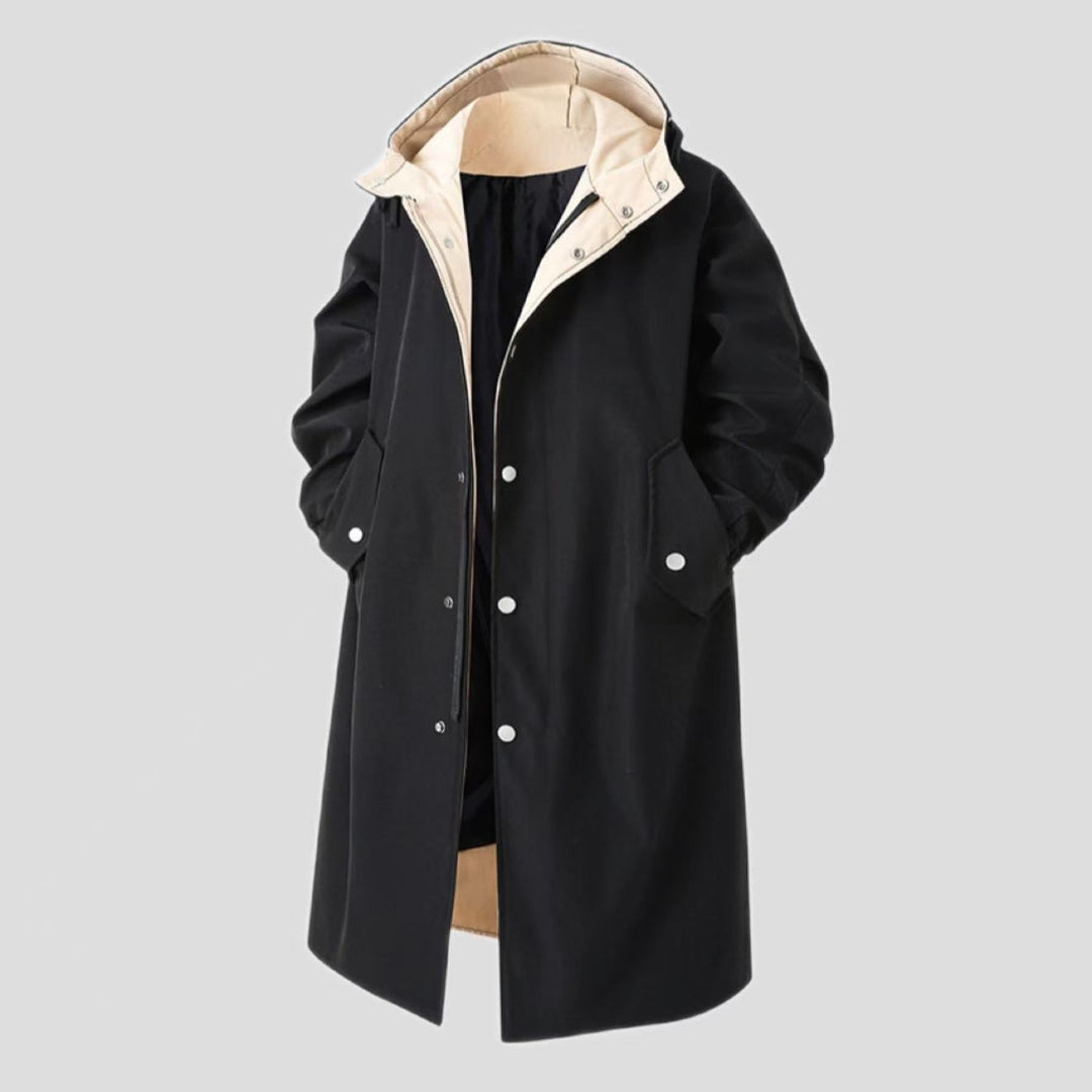 Men's mid-length trench coat in black with hood and buttoned front, long sleeves, flap pockets.