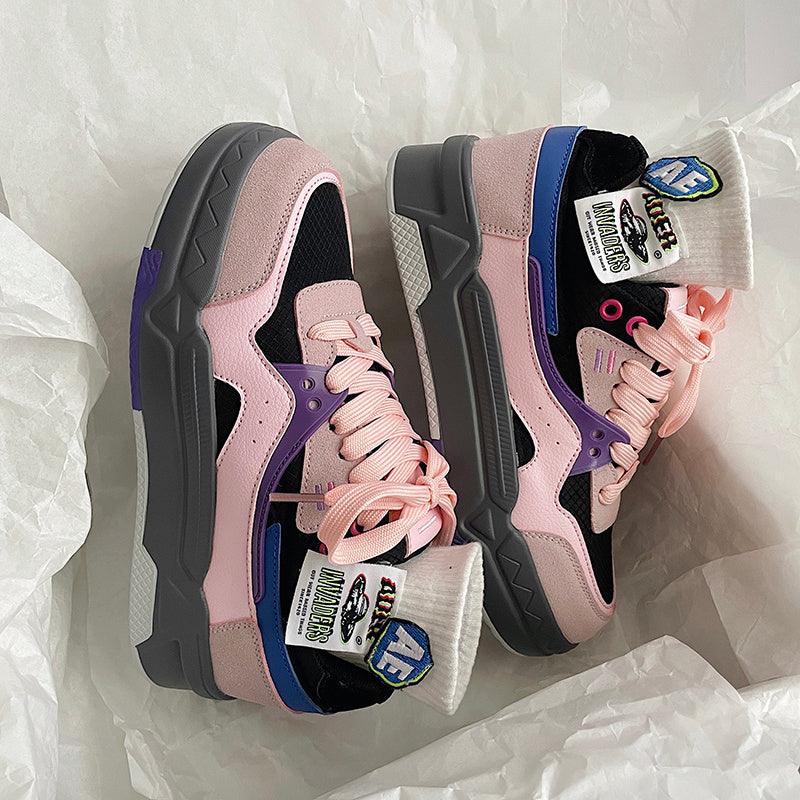 Low-cut anti-slip board shoes in pink, lavender, and dark gray with pink laces.